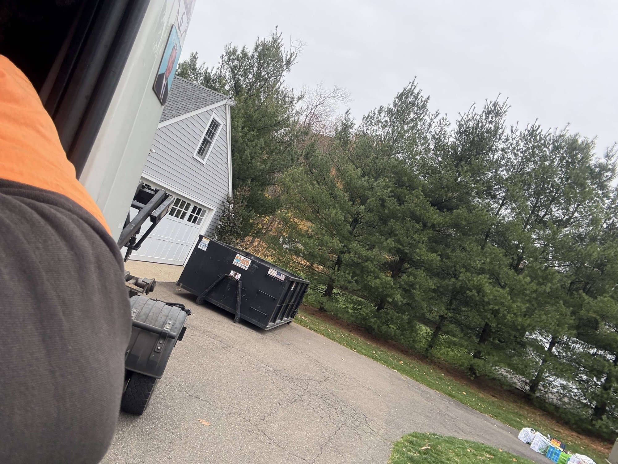 dumpster rental delivery in Darien, CT by Grizzly Junk Pros
