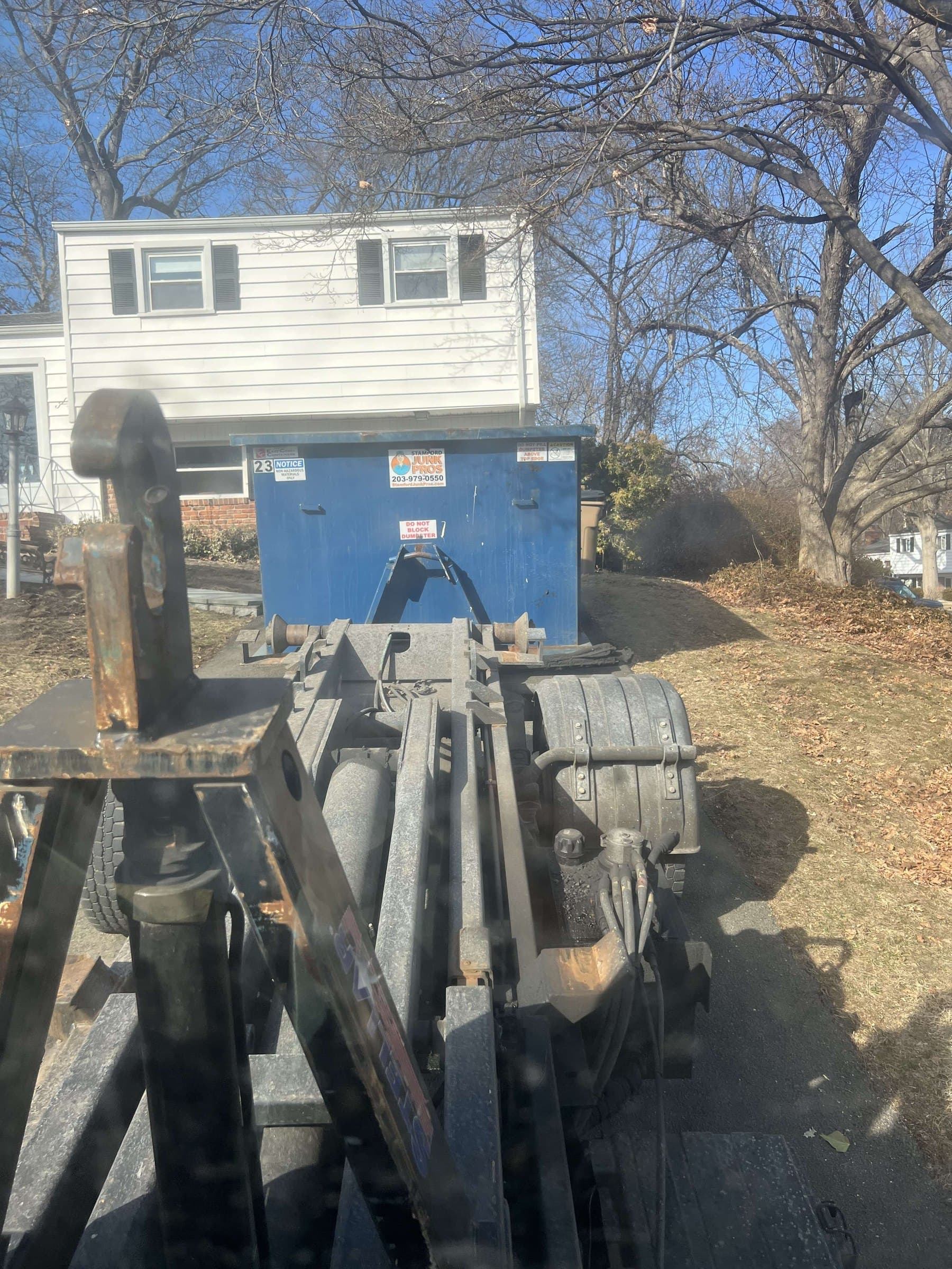 dumpster truck hitch in Darien, CT by Grizzly Junk Pros