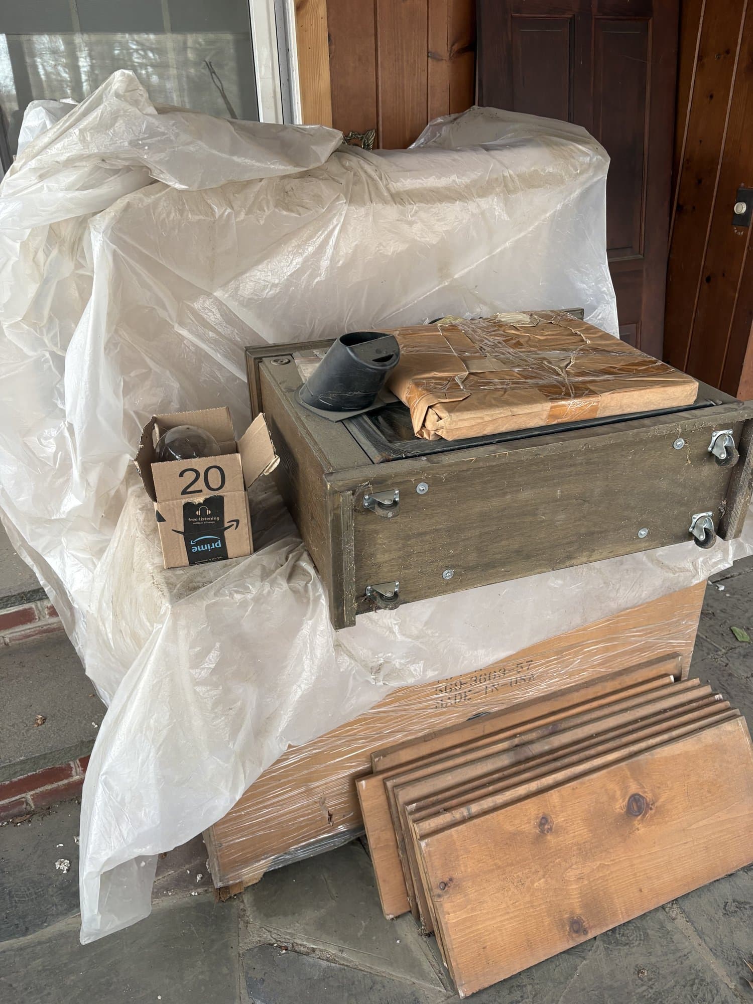 Cabinet parts and boxes staged for removal