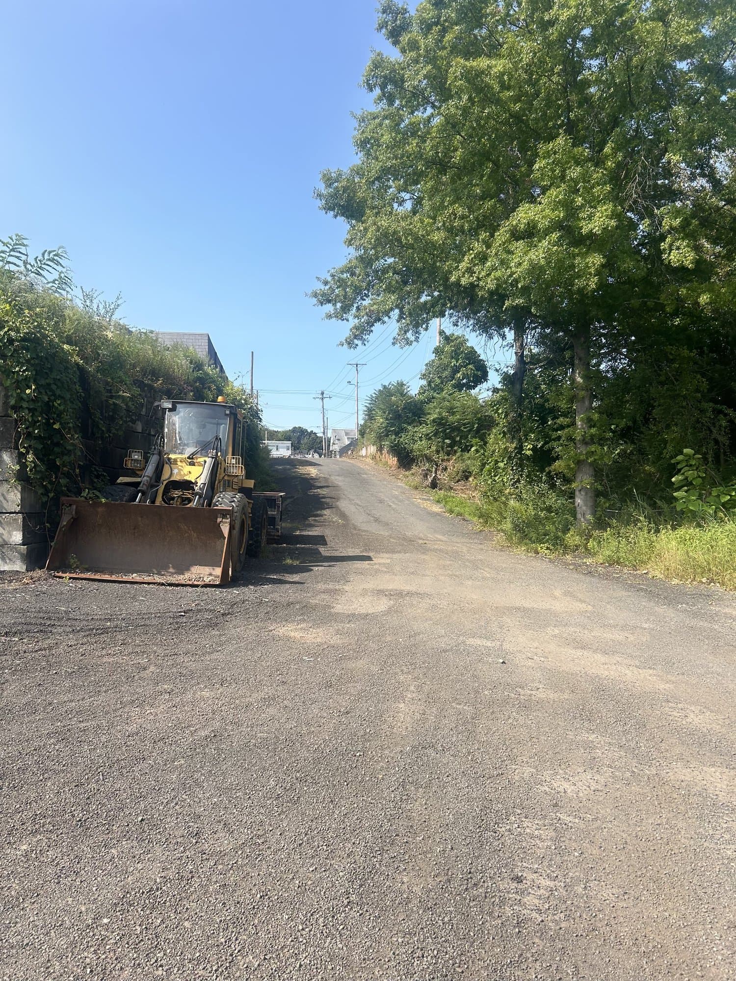 driveway cleanup equipment in West Haven, CT by Grizzly Junk Pros